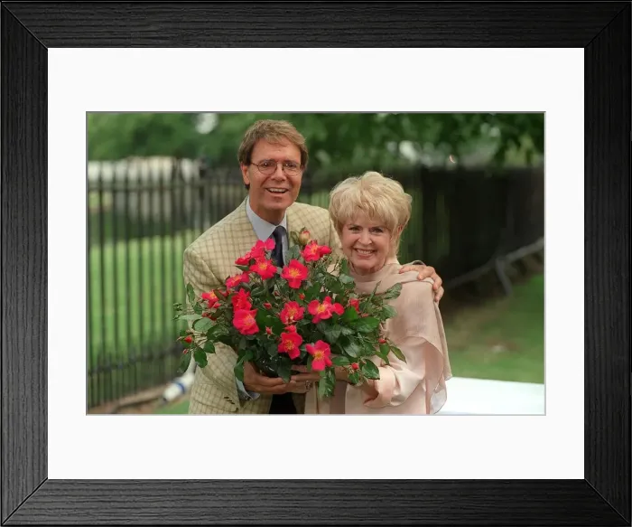 Framed Print : Cliff Richard and Gloria Hunniford in July 1999, at the Hampton Court Flower Show 1999 Framed Print : Cliff Richard and Gloria Hunniford in July 1999, at the Hampton Court Flower Show 1999