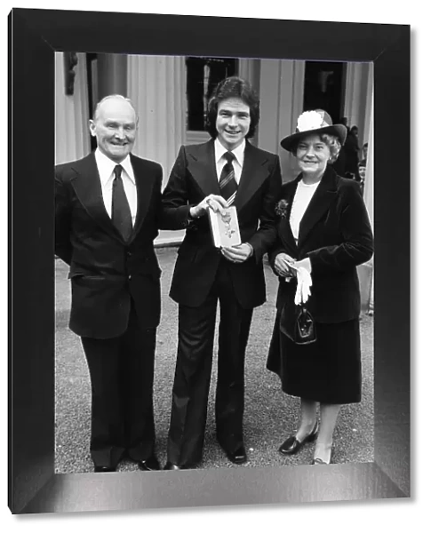 Barry Sheene with his mother and father and MBE, March 1978
