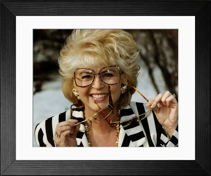 Framed Print : Gloria Hunniford TV Presenter holding glasses in hand voted spectacle wearer of the Year