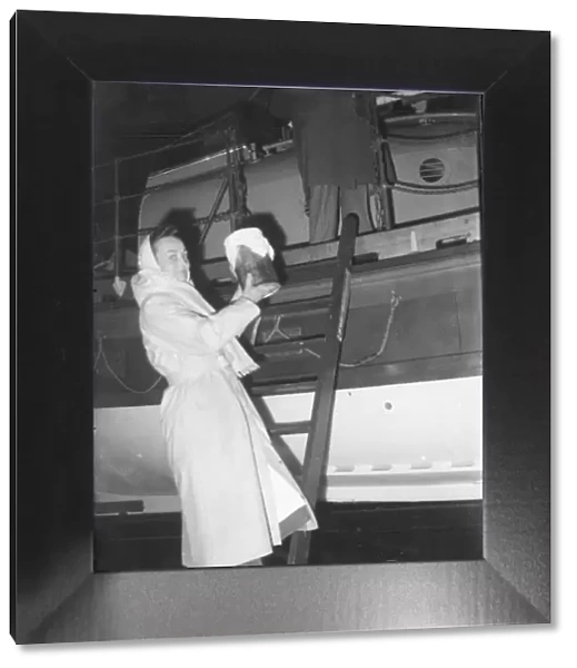 Sister Clevely stepping aboard the SENNEN lifeboat january 1952 C134  /  2