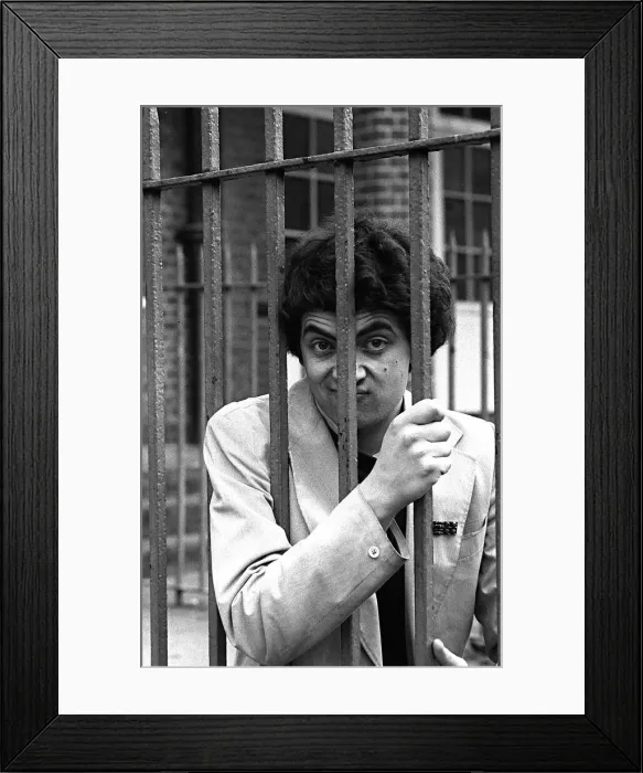Framed Print : Comedian Rowan Atkinson behind bars April 1980