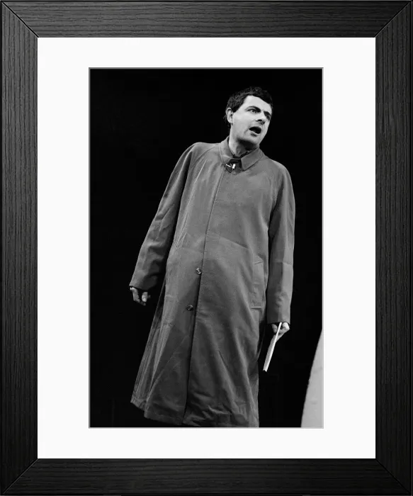 Framed Print : Rowan Atkinson during Royal Variety show rehearsals 1984 in raincoat