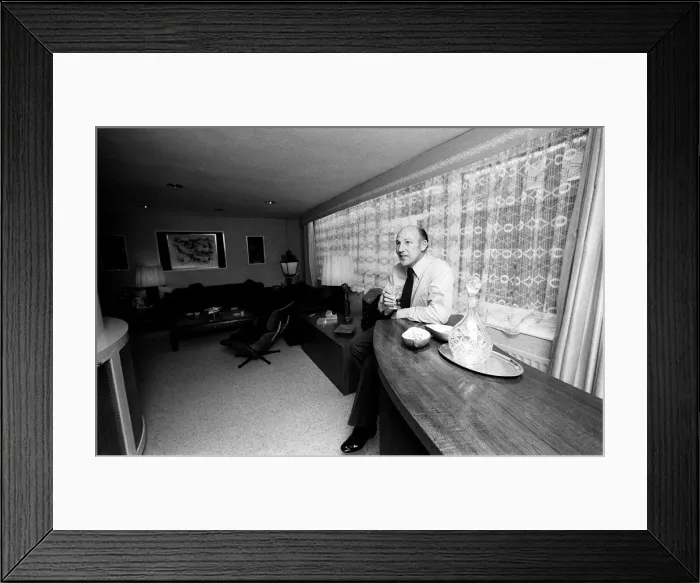 Framed Print : Racing driver Stirling Moss in his new home 1978 Framed Print : Racing driver Stirling Moss in his new home 1978
