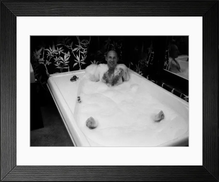 Framed Print : Stirling Moss in bath at his new home 1978