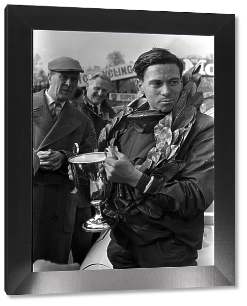 Jim Clark motor racing champion with trophy in 1963