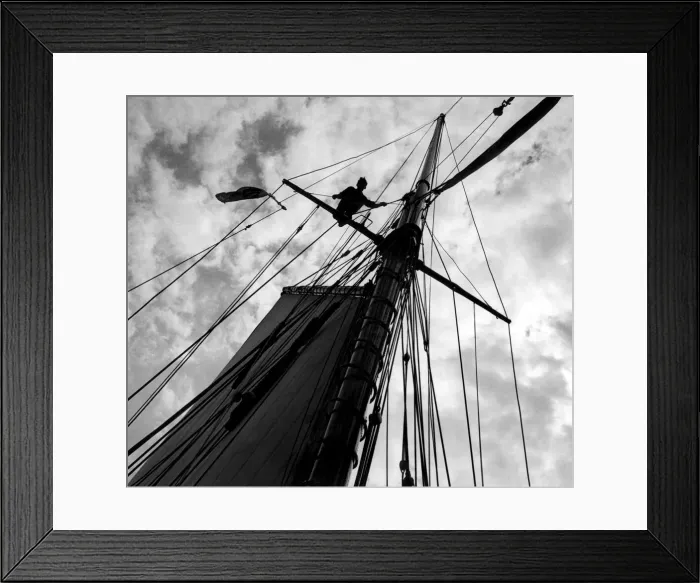 Framed Print : S. L. C. Latham, aged 17, astride the cross tree helping to send up the top mast a board Framed Print : S. L. C. Latham, aged 17, astride the cross tree helping to send up the top mast a board