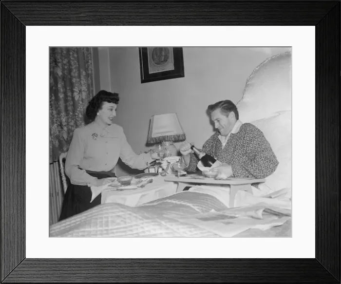 Framed Print : Film stars celebrate 1st Wedding Anniversary. 1949 John McCallum in bed with Framed Print : Film stars celebrate 1st Wedding Anniversary. 1949 John McCallum in bed with