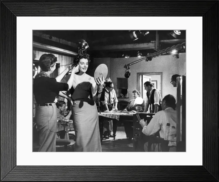 Framed Print : An un-named actress has her make-up touched up between filming at Ealing Studios Framed Print : An un-named actress has her make-up touched up between filming at Ealing Studios