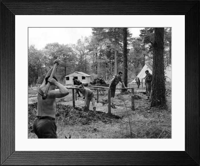 Framed Print : Woodland camp Voulenteers building a bridge around the camp. May 1933 P000023