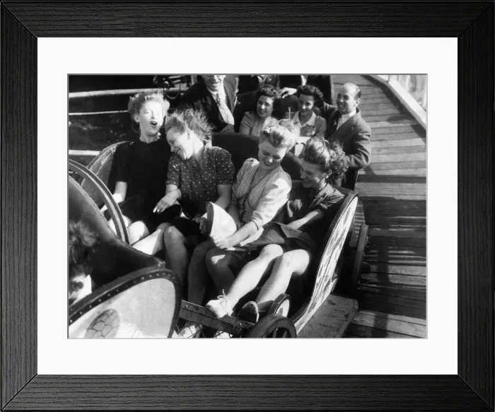 Framed Print : Four friends enjoy a fairground ride during the August Bank Holidays. August 1946 P000019