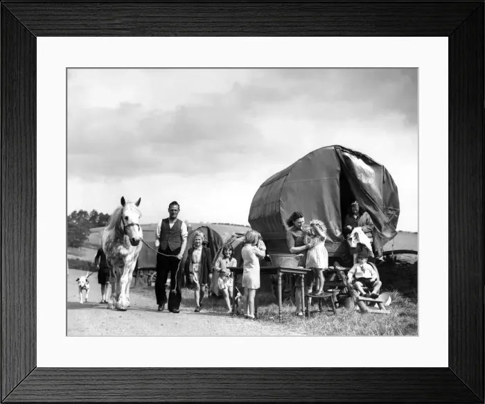 Framed Print : A gypsie caravan parked in a field is home to some of the evacuees who have fled London
