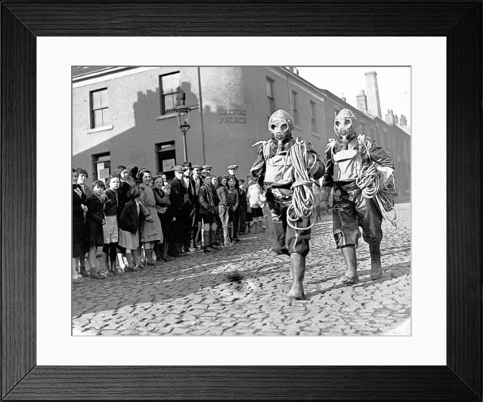 Framed Print : Two air raid wardens cause a stir as they stroll about Newcastle in February 1939 in full