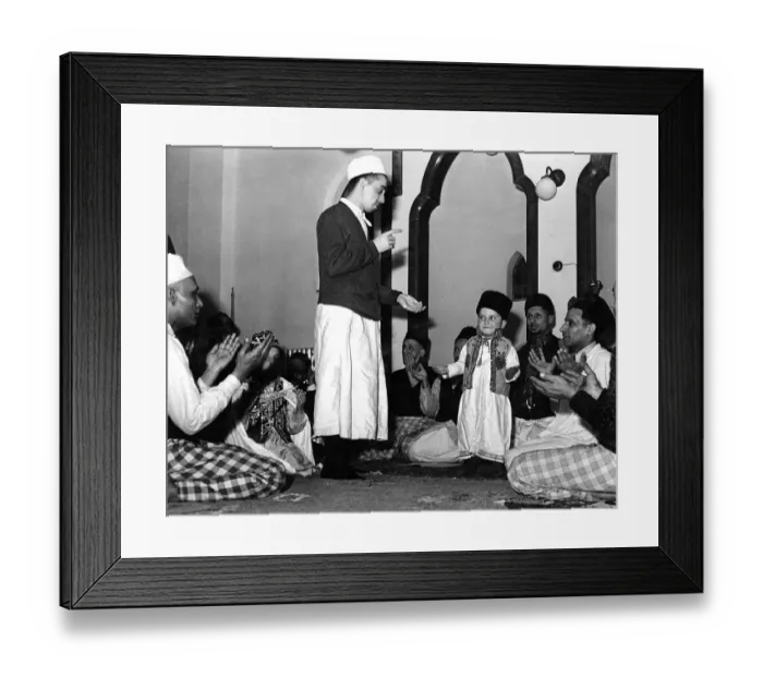 Framed Print : Religion Muslim A small boy is initiated into the mosque and the muslim faith