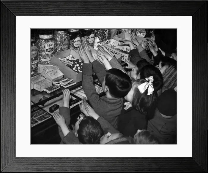 Framed Print : Children invade sweet shop after rationing ends in Glasgow, Scotland. 1949 Framed Print : Children invade sweet shop after rationing ends in Glasgow, Scotland. 1949