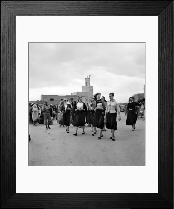 Framed Print : Group of French actresses walk through the streets and market square in Marrakech