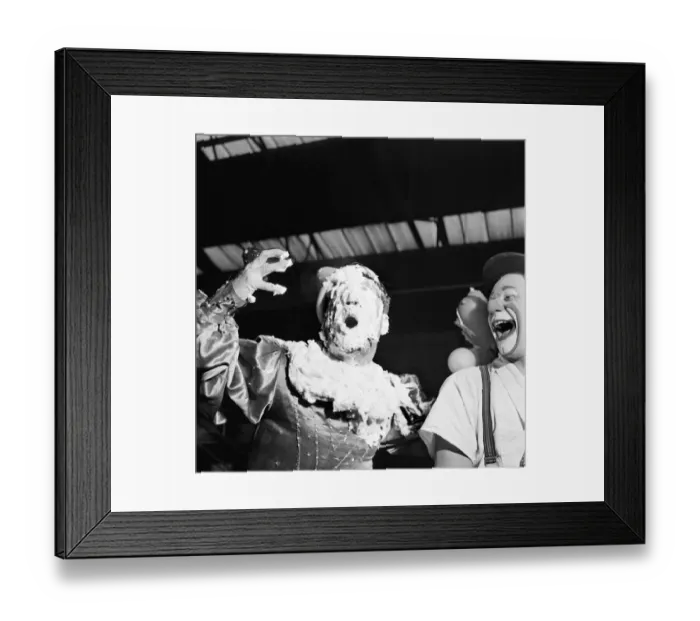 Framed Print : Clowns Michael and Sasha Coco covered in cream after being hit in the face by a pie