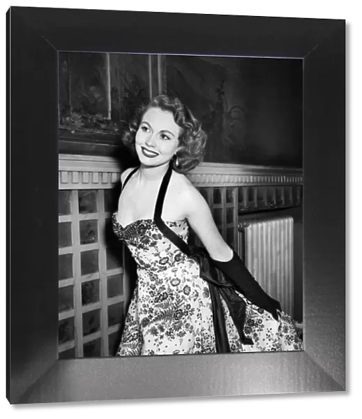 Clothing Fashion 1953. Miss Hazel Court arrives wearing a black velvet floral design