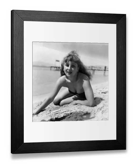 Framed Print : Cannas Film Festival. Holiday Maker Simone Gervais seen here on the beach at Cannes