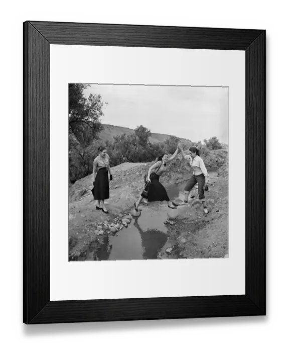 Framed Print : French actresses on a visit to Morroco speak to a local guide as he takes them Framed Print : French actresses on a visit to Morroco speak to a local guide as he takes them