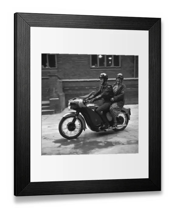 Framed Print : With her crash helmet on fair and square, and goggles flipped back