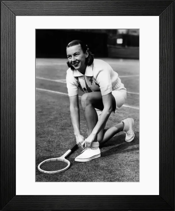 Framed Print : Gussie Moran playing tennis at Queens Club September 1949 adjusting her Framed Print : Gussie Moran playing tennis at Queens Club September 1949 adjusting her