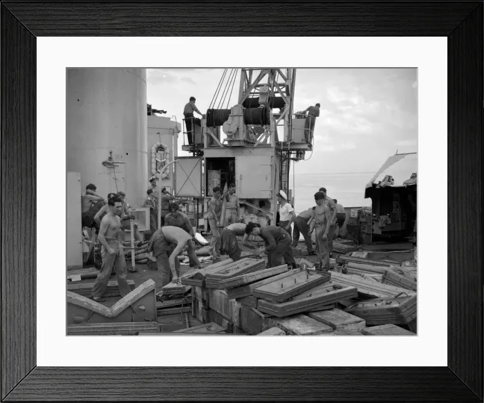 Framed Print : The crew of the County Class cruiser HMS London taking on board supplies Framed Print : The crew of the County Class cruiser HMS London taking on board supplies