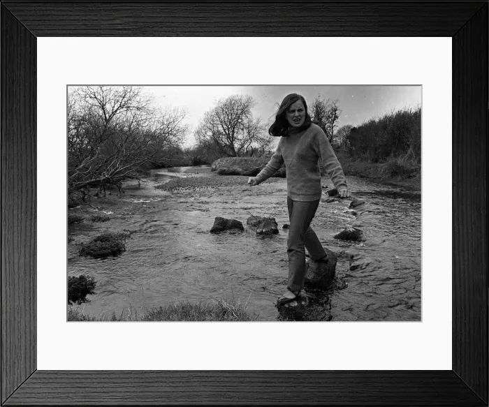 Framed Print : Bernadette Devlin MP for Mid Ulster walking on stepping stones across a river Framed Print : Bernadette Devlin MP for Mid Ulster walking on stepping stones across a river