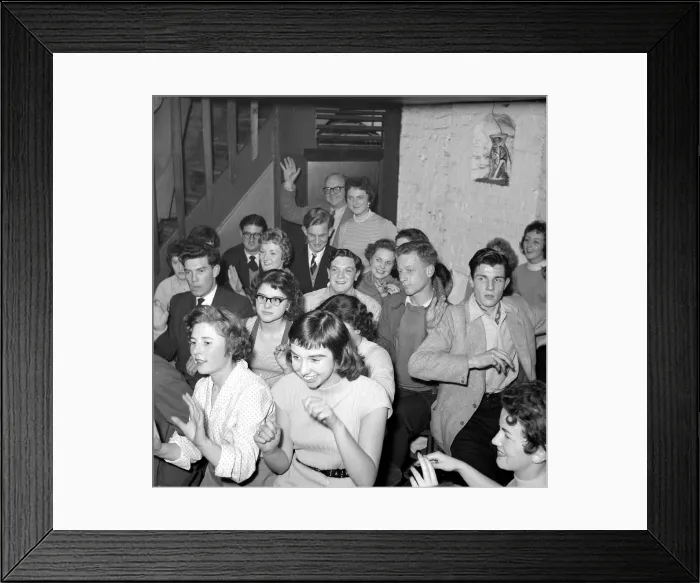 Framed Print : A group of men and women sitting down hand jiving Circa 1955 Framed Print : A group of men and women sitting down hand jiving Circa 1955