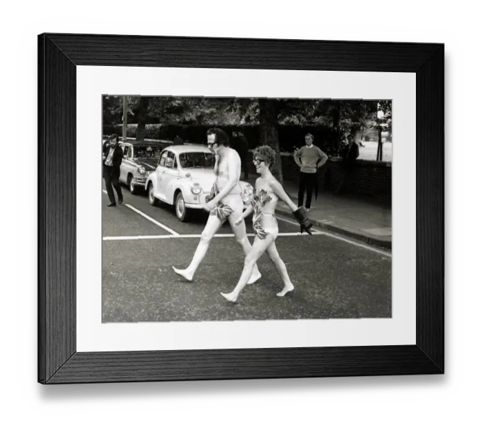 Framed Print : Actors Bill Bailey and Marie Adams crossing Bayswater Road in London naked as they