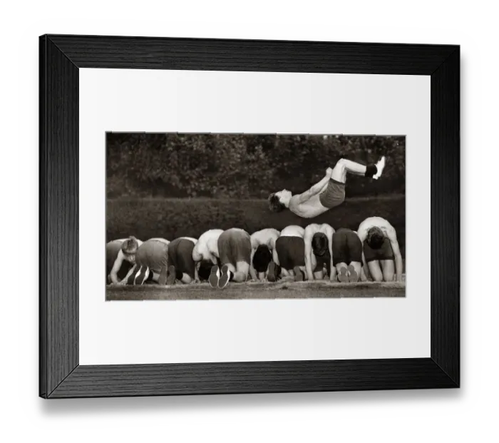 Framed Print : Fifteen year old Ronnie Laing leaping over a dozen of his colleagues in training for next Framed Print : Fifteen year old Ronnie Laing leaping over a dozen of his colleagues in training for next