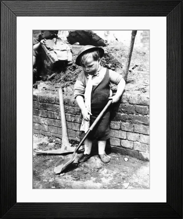 Framed Print : War 1939-45 Little boy playing on a Bomb site Framed Print : War 1939-45 Little boy playing on a Bomb site
