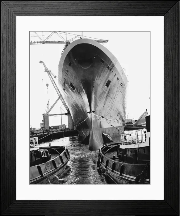 Framed Print : QE2 being towed into a fitting out basing by tugs Framed Print : QE2 being towed into a fitting out basing by tugs