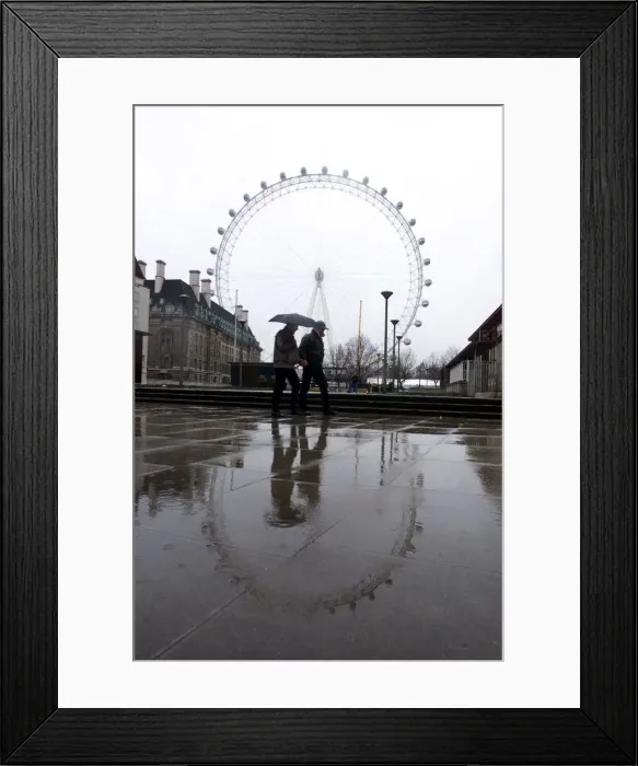 Framed Print : Preparations being made for a wet Millennium night at the Mall FunFair Framed Print : Preparations being made for a wet Millennium night at the Mall FunFair