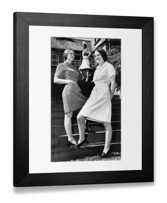 Framed Print : Old and new nurses uniforms modelled by Shirley Smith, background