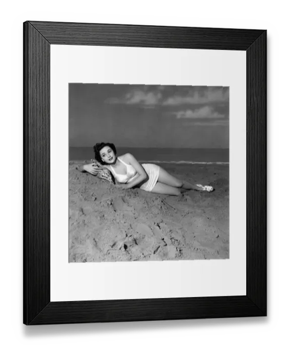 Framed Print : Film star Lara Morris in new bathing costume made of white satiri and elastic