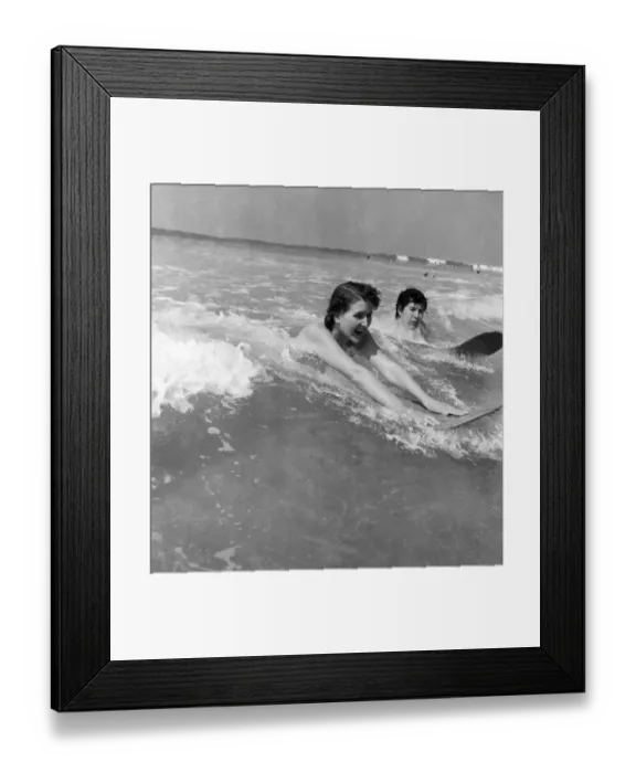 Framed Print : Holidays. Two shop assistants surfing at newquay, Cornwall. May 1953 D2386