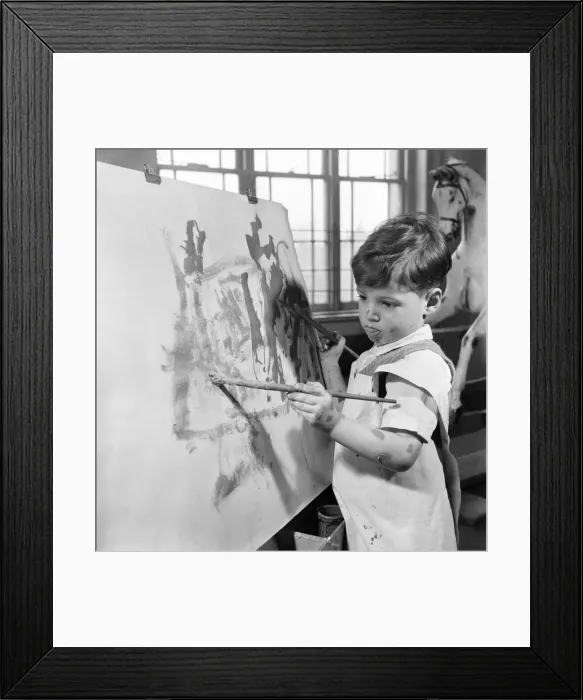 Framed Print : The four year old two handed artist is Louis Savva at work on his masterpiece