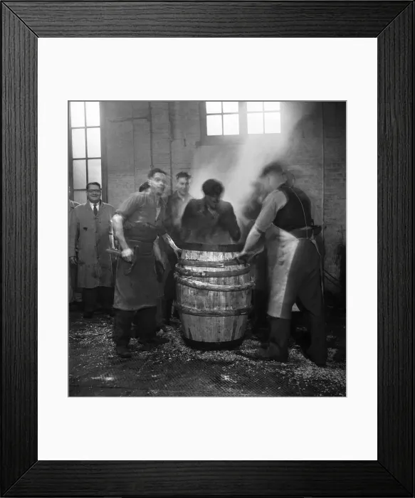 Framed Print : An apprentice cooper finishes his training seen her undergoing the Custom of finishing Framed Print : An apprentice cooper finishes his training seen her undergoing the Custom of finishing