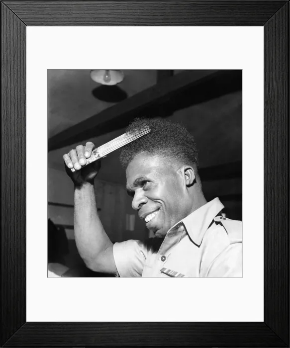 Framed Print : Lance Corporal gan ki of the Royal Papua New Guinea Police force seen here combing his Framed Print : Lance Corporal gan ki of the Royal Papua New Guinea Police force seen here combing his