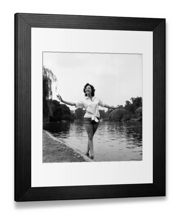 Framed Print : Actress Lana Morris wears a shirt over her shorts. August 1949 O20168-001