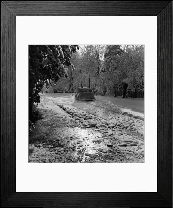 Framed Print : Car drives along a road covered in deep snow in Tadworth. April 1950 O23770-007 Framed Print : Car drives along a road covered in deep snow in Tadworth. April 1950 O23770-007