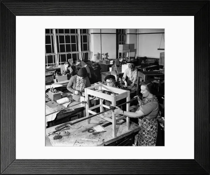 Framed Print : A general view of the woodwork class showing 6 women to one male student at work Framed Print : A general view of the woodwork class showing 6 women to one male student at work