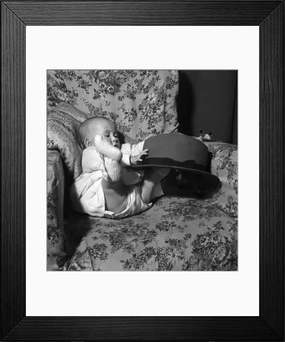 Framed Print : Baby Joy Sidy seen here playing with her fathers hat. March 1953 D1398 Framed Print : Baby Joy Sidy seen here playing with her fathers hat. March 1953 D1398