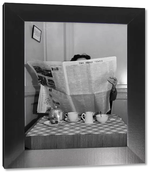 Man reading the Times newspaper. April 1953 D1955