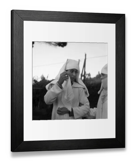 Framed Print : Woman putting on a Djellabah traditional dress. January 1953 D216-014 *** Local Caption