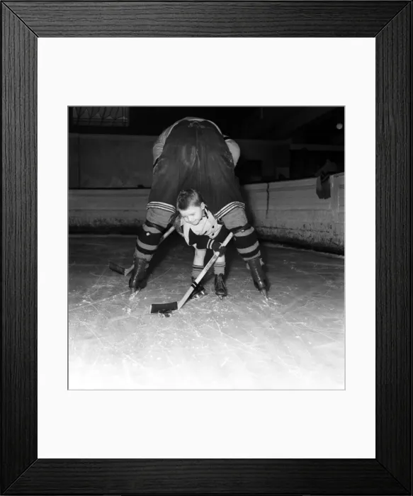 Framed Print : Les Anning (Ice Hockey Player) Seen here playing with his son. March 1953 D1236 Framed Print : Les Anning (Ice Hockey Player) Seen here playing with his son. March 1953 D1236
