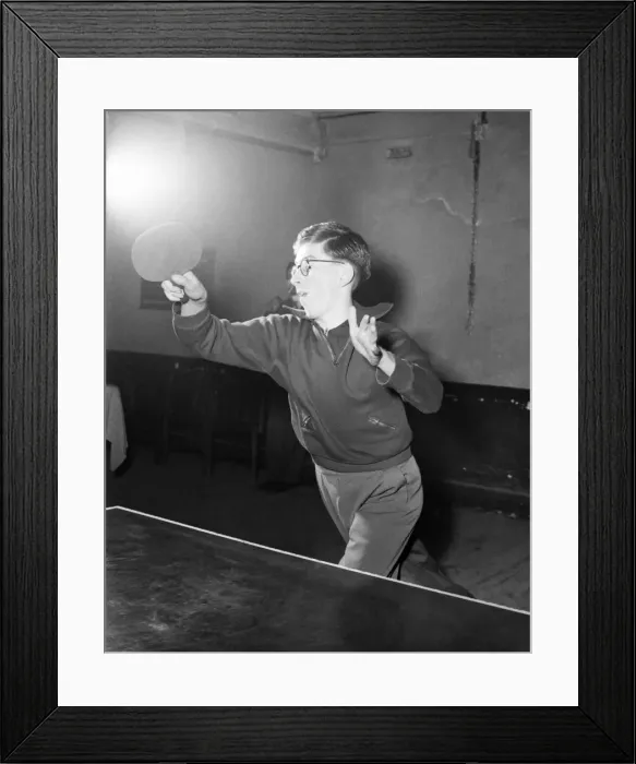 Framed Print : Young boy playing table tennis. January 1953 D232-003