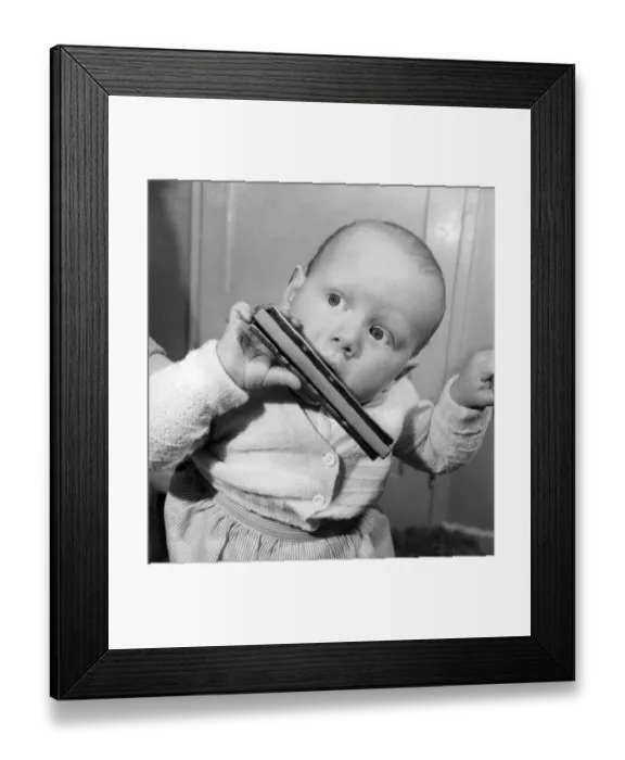 Framed Print : Christopher Thomas with his Dads mouth organ. And playing a duet with his Mother