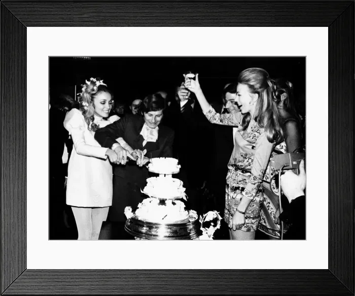 Framed Print : Roman Polanski Film Director with his wife Sharon Tate cutting cake at their wedding