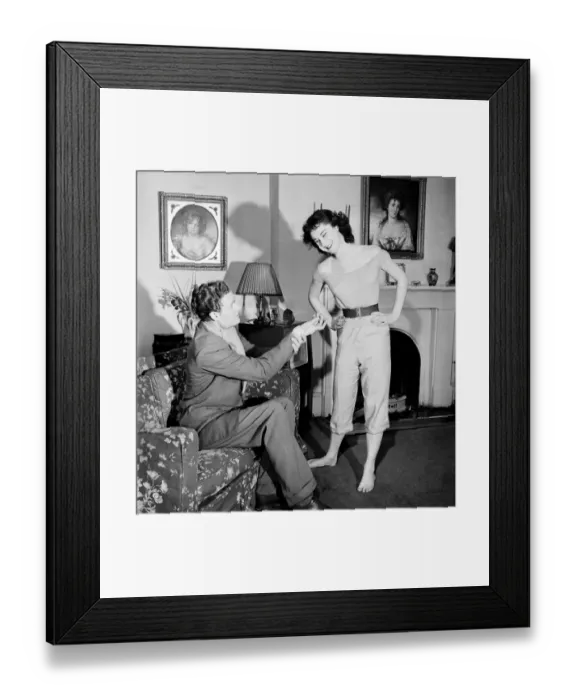 Framed Print : Judo Girl throwing her husband over her shoulder in her living room